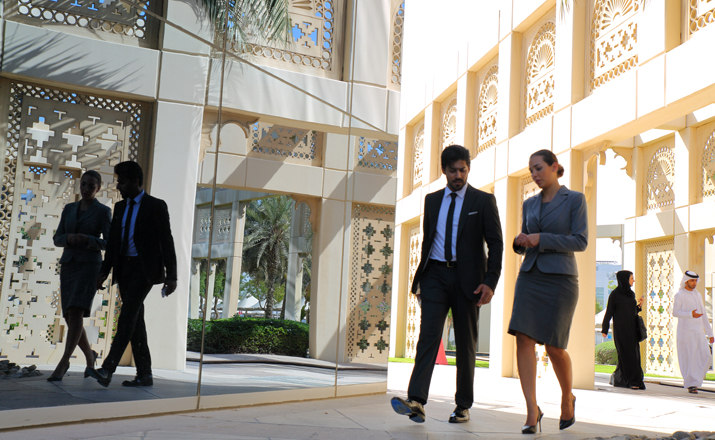 Businesswoman and businessman walking, having a discussion